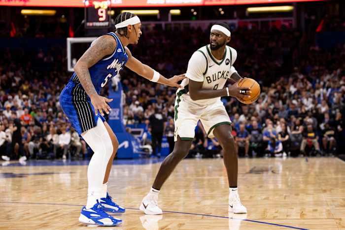 Orlando Magic forward Paolo Banchero (5) defends Milwaukee Bucks forward Bobby Portis (9)